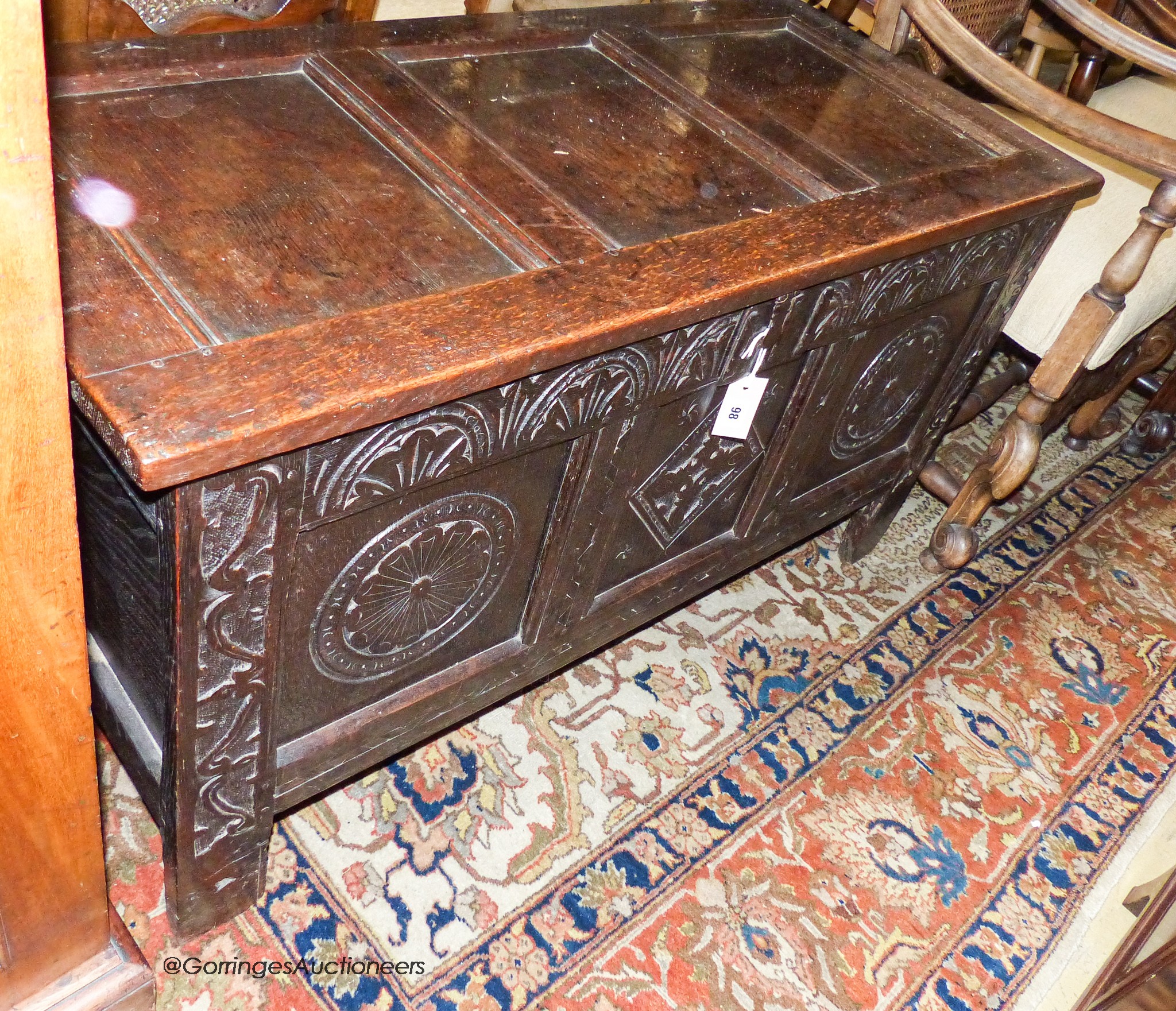 A late 17th century carved and panelled oak coffer, length 118cm, depth 52cm, height 64cm